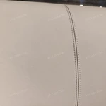 Soft Upholstered Bed with Embossed Brand Mark, Rich-Patterned Natural Wood Veneer Trim & Polished Gold Stainless Steel Accents